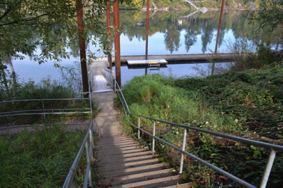 Ramp with railing/stairs at the top of boat ramp – access by river or Oak Grove overflow parking